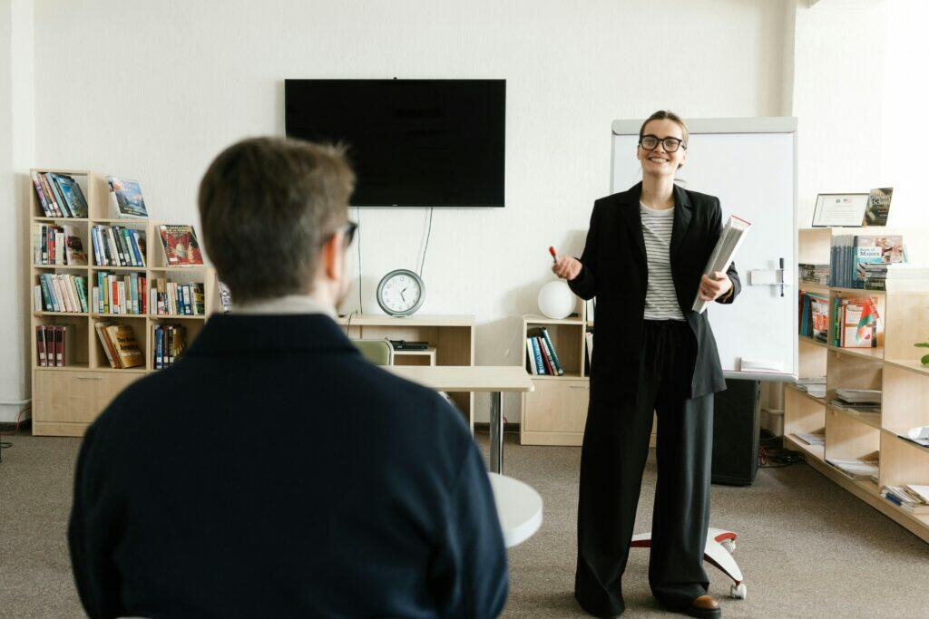 Woman presenting to a student during a home loan credit assistance training session.