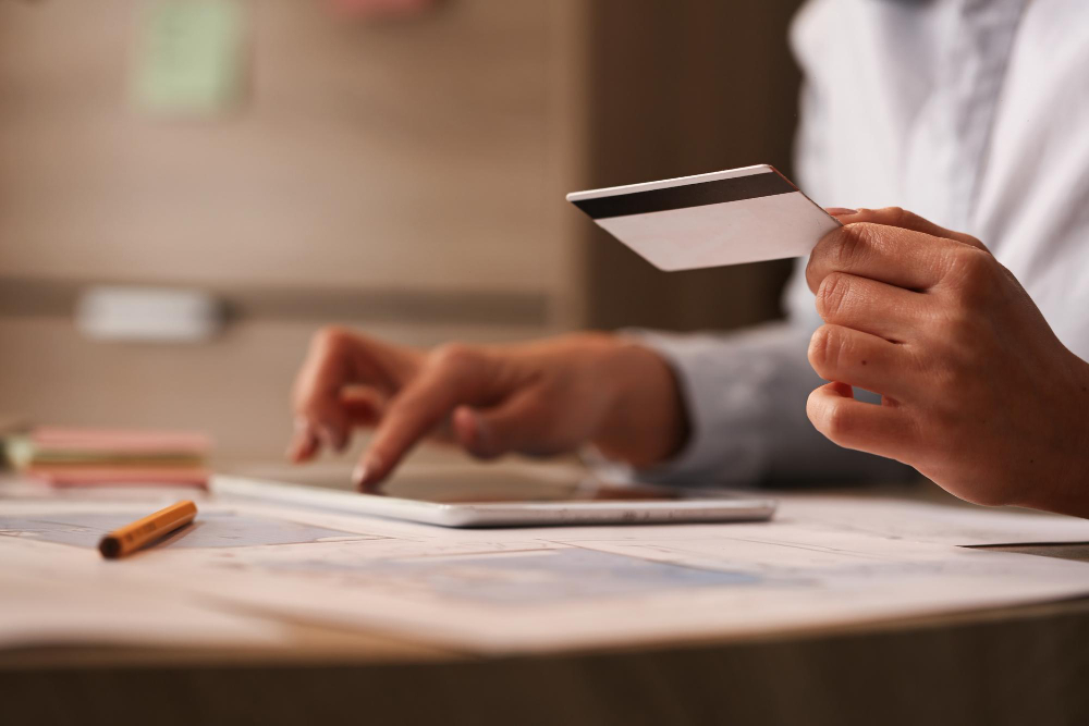 Paying online with a credit card on a tablet. Non-cash payment concept.